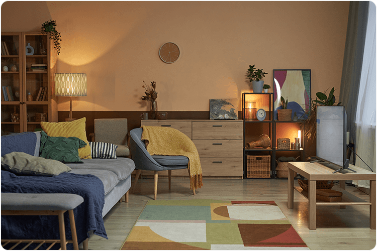 Cosy living room interior with low lighting and colorful decor copy space